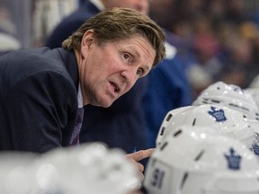 Maple Leafs head coach Mike Babcock speaks to his players as they take on the Senators during first period NHL pre-season action in Saskatoon on Tuesday, Oct. 4, 2016. (Liam Richards/The Canadian Press)