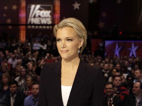 In this Jan. 28, 2016 file photo, Moderator Megyn Kelly waits for the start of the Republican presidential primary debate in Des Moines, Iowa. Kelly's Fox News colleague, Sean Hannity, accused Kelly of backing Hillary Clinton on Wednesday, Oct. 5, 2016. The spat began Wednesday night on Kelly’s program, when the anchor criticized both GOP presidential nominee Donald Trump and the Democratic candidate, Clinton, of avoiding tough media interviews. Kelly said Trump “will go on Hannity and pretty much only Hannity.” Hannity responded on Twitter that Kelly “clearly” supports Clinton. (AP Photo/Chris Carlson, File)