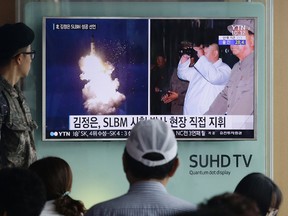In this Thursday, Aug. 25, 2016, file photo, a South Korean army soldier watches a TV news program showing images published in North Korea's Rodong Sinmun newspaper of North Korea's ballistic missile believed to have been launched from underwater and North Korean leader Kim Jong-un, at Seoul Railway station in Seoul, South Korea. North Korea’s torrent of weapons tests in 2016 has strengthened Pyongyang militarily, but the real reason behind the rush is the U.S. presidential elections, according to a growing number of experts on North Korea. Kim Jong Un has forged an increasingly sophisticated arsenal. There have been truck-launched missile tests, two nuclear explosions, experiments with powerful rocket engines and more than a dozen other major missile trials. (AP Photo/Ahn Young-joon, File)