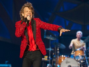 In this July 4, 2015 file photo, Mick Jagger of the Rolling Stones performs at the Indianapolis Motor Speedway in Indianapolis, Ind. (Photo by Barry Brecheisen/Invision/AP, File)