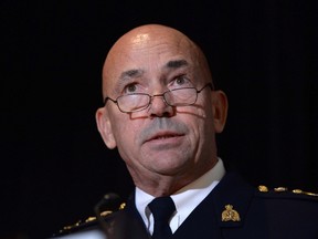 RCMP commissioner Bob Paulson speaks during a news conference in in Ottawa on Thursday, Oct. 6, 2016. Paulson has apologized to hundreds of current and former female officers and employees for alleged incidents of bullying, discrimination and harassment. THE CANADIAN PRESS/Adrian Wyld