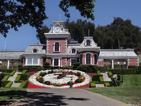 In this July 2, 2009, file photo workers standby at the train station at Neverland Ranch in Los Olivos, Calif. Paris Jackson, the daughter of Michael Jackson, Jackson posted pictures on Instagram from her late father’s famous estate Wednesday, Oct. 5, 2016, writing “felt so good to be home even for a little bit.” (AP Photo/Carolyn Kaster, File)