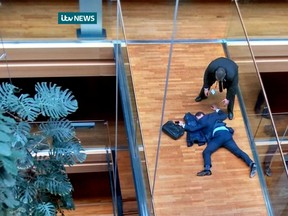 A handout picture released by ITV NEWS on October 6, 2016 shows UK Independence Party MEP, Steven Woolfe, lying face-down on a walk-way inside the European Parliament building in Strasbourg in eastern France. (ITV NEWS/AFP/Getty Images)