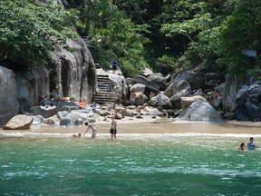 Tourists and locals arriving by boat last week enjoy the small hidden beach at Colomitis Cove, south of Puerto Vallarta, Mexico. (BARBARA TAYLOR The London Free Press)