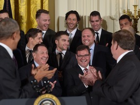 President Barack Obama turns to applaud Pittsburgh Penguins Phil Kessel after talking about him during a ceremony in the East Room of the White House in Washington, D.C., on Oct. 6, 2016. (AP Photo/Susan Walsh)