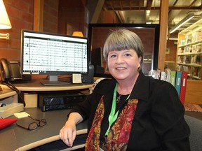 Jo Stanbridge, the history and genealogy librarian at the downtown branch of the Kingston Frontenac Public Library, in Kingston on Thursday will be demonstrating an online genealogy tool during a workshop later this month. (Michael Lea/The Whig-Standard)