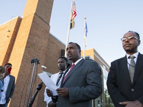 Abdulwahid Osman, the lawyer for the family of Dahir Ahmed Adan, speaks during a news conference at St. Cloud City Hall in St. Cloud, Minn., Monday, Sept. 19, 2016. (Leila Navidi/Star Tribune via AP)