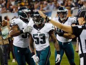 Philadelphia Eagles linebacker Nigel Bradham (centre) was arrested during the bye week when he forgot he had a loaded gun in his backpack while trying to go through airport security.  (AP)