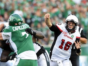 Redblacks quarterback Brock Jensen throws during CFL action against the Roughriders at Mosaic Stadium in Regina on July 22, 2016. (DON HEALY/Postmedia Network)