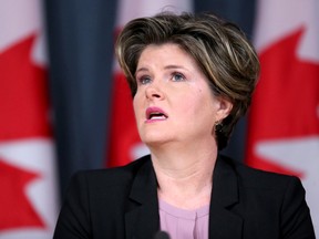 Alison Azer, the mother of four abducted children by her former husband, Saren Mahmudi-Azer, to Iran, felt "disrespected and dishonoured" when Foreign Affairs Minister Stephane Dion make a thumbs-down gesture when her ordeal came up in the House of Commons. (JULIE OLIVER Postmedia Network)