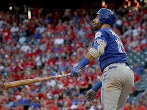 Jose Bautista of the Toronto Blue Jays hits a three-run home run to left field against Jake Diekman of the Texas Rangers during the ninth inning in Game 1 of the American League Division Series at Globe Life Park in Arlington on Oct. 6, 2016 in Arlington, Texas. (Ronald Martinez/Getty Images)