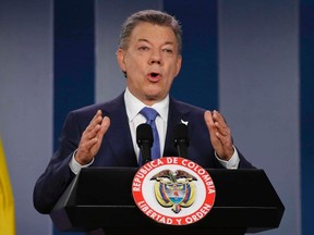 Colombian President Juan Manuel Santos delivers a statement to the press after meeting with former President Alvaro Uribe and other opposition leaders at the presidential palace in Bogota, Colombia. Colombian President Juan Manuel Santos has won Nobel Peace Prize it was announced on Friday Oct. 7, 2016. (AP Photo/Fernando Vergara, File)