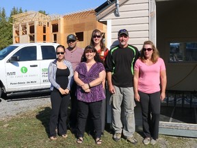 BRUCE BELL/THE INTELLIGENCER
A solar generator system installed by Tri-Canadian Energy will allow a new home on County Road 17 to operate completely on renewable energy. Pictured beside a temporary unit being used until construction is complete are Tri-Canadian employees (from left) Bailey Shaddick, James Spicer, Crystal Demedeiros and Barb Spry along with homeowners Owen and Colleen Miller.