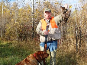 Neil and Penny with a ruffed grouse in what could be a population peak year. Neil Waugh