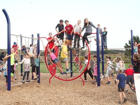 The Seaforth Public students and locals enjoy the new climber that was installed last September, in the official grand opening of the recently purchased equipment October 6.(Shaun Gregory/Huron Expositor)