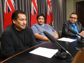 Norman Barkman (left) and Luke Monias (centre) speak at a press conference with Eric Robinson last November. The two Garden Hill First Nation men were born to Rebecca Barkman and Rosamund Monias and switched at birth. RCMP are now investigating. (THE CANADIAN PRESS/John Woods file photo)