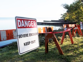 Warning signs are up at the end of Blackwell Sideroad in Sarnia, where shoreline is eroding into Lake Huron after a seawall recently failed. The city is looking into a temporary fix, likely involving armour stones, Sarnia's construction manager says. (Tyler Kula/Sarnia Observer)