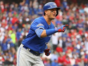 Troy Tulowitzki of the Toronto Blue Jays reacts after hitting a home run against the Texas Rangers during the second inning in Game 2 of the American League Division Series at Globe Life Park in Arlington on Oct. 7, 2016. (Scott Halleran/Getty Images)