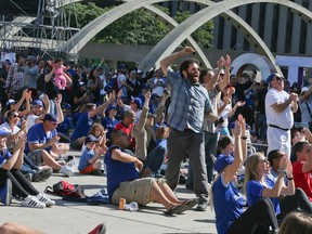 Toronto Blue Jays fan gather at the Bird's Nest in Nathan Phillips Square to watch the second game of the ALDS against the Texas Rangers on Friday October 7, 2016. (Veronica Henri/Toronto Sun)