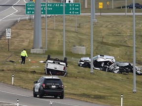 Police investigate a fatal collision between two pickup trucks, one of which crossed the centre median and struck the other on Anthony Henday Dr. northbound which was closed most of the day near Lessard Rd. in Edmonton Friday, October 7, 2016. Ed Kaiser/Postmedia