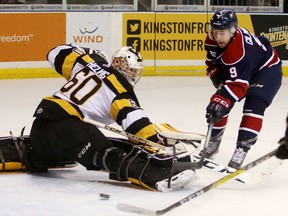 Saginaw Spirit forward Brady Gilmour takes a shot on Kingston Frontenacs goaltender Jeremy Helvig during the first period of Ontario Hockey League action at the Rogers K-Rock Centre in Kingston on Friday night. (Elliot Ferguson/The Whig-Standard)