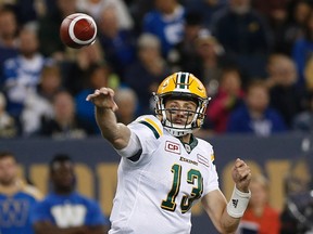 Edmonton Eskimos quarterback Mike Reilly (13) throws against the \Winnipeg Blue Bombers during the first half of CFL action in Winnipeg Friday, September 30, 2016.