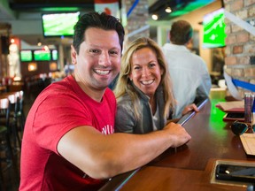 Robert and Heather Rotondi, of New Jersey, are pictured \ at Wayne Gretzky's bar in downtown Toronto. (ERNEST DOROSZUK, Toronto Sun)
