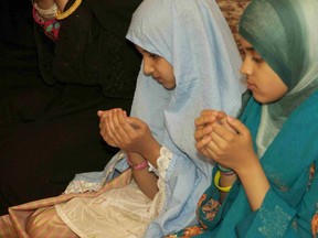 Young girls raise their hands in supplication (dua) to God, during pre-Iftar prayers at the Sudbury mosque, in this file photo. Perspectives on Mercy will be presented at a public gathering at the Sudbury Mosque on Sunday, Oct. 16 from 2-4 p.m. Speakers from Judaism, Christianity and Islam will share their various perspectives on the mercy of God, along with their own experiences. For info on this, call 705-692-9603, or visit the Facebook page for Sudbury Interfaith Dialogue. MARY KATHERINE KEOWN/FOR THE SUDBURY STAR