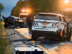 In this still image from video provided by WCAX-TV, workers remove vehicles from Interstate 89 early Sunday, Oct. 9, 2016, in Williston, Vt., after a wrong-way driver caused a crash just before midnight that killed multiple people, before stealing a police cruiser, striking several vehicles and injuring several people. 
(WCAX-TV via AP)