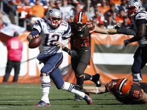 Tom Brady of the New England Patriots looks to pass while under pressure in the third quarter of the game against the Cleveland Browns at FirstEnergy Stadium on October 9, 2016 in Cleveland, Ohio. The Patriots defeated the Browns 33-13. (Photo by Joe Robbins/Getty Images)