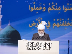 Mirza Masroor Ahmad, the Caliph, or spiritual leader, of the Ahmadiyya Muslim Jama'at addresses Canada's Jalsa Salana -- an annual meeting of Muslims who belong to the sect -- in Mississauga, Ont., in an undated handout photo. THE CANADIAN PRESS/HO-Ahmadiyya Muslim Jama'at