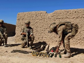 Afghan National Army commandos take position during an ongoing battle between Taliban militants and Afghan security forces in Helmand province on October 10, 2016. At least 14 people, mostly Afghan security forces were killed in southern Afghan city of Lashkar Gah on October 10, after the Taliban insurgents launched a coordinated attack involving a car bomb, to breach the city defences, Afghan officials said. (NOOR MOHAMMADNOOR MOHAMMAD/AFP/Getty Images)