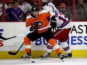 Travis Konecny #63 of the Philadelphia Flyers tries to keep the puck from Kevin Hayes #13 of the New York Rangers during a  preseason game on October 3, 2016 at Wells Fargo Center in Philadelphia, Pennsylvania.  (Photo by Elsa/Getty Images)