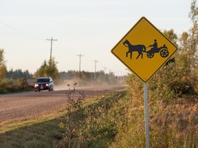 A horse and buggy road sign is seen in Summerville, P.E.I., on Saturday, Oct. 8, 2016. Over the past year, eastern Prince Edward Island has become a bit of an Amish paradise, and Islanders are welcoming the new settlers with open arms. THE CANADIAN PRESS/Andrew Vaughan