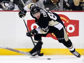 In this Feb. 29, 2016, file photo, Pittsburgh Penguins center Sidney Crosby plays during an NHL hockey game against the Arizona Coyotes in Pittsburgh. (AP Photo/Gene J. Puskar, File)
