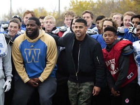 The Bombers surprised the team at their practice Monday with a visit from offensive linemen Stanley Bryant and Jermarcus Hardrick, running back Andrew Harris and kicker Justin Medlock.