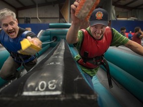 Counsellor Stephen Judge and camper Jaired Heinrichs compete in a bungee run at burn camp.