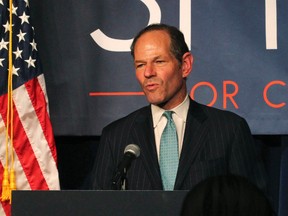 In this Sept. 10, 2013, file photo, former New York Gov. Eliot Spitzer delivers his concession speech at his election night party after losing the Democratic primary race for New York City comptroller in New York. A 26-year-old woman who accused Spitzer of assaulting her has been arrested for trying to extort money from him. Police said Svetlana Zakharova was arrested in New York on Monday, Oct. 10, 2016. (AP Photo/Tina Fineberg, File)