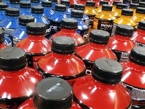 FILE - In this May 18, 2016 file photo, sodas and energy drinks are stacked and line the shelves in a grocery store in Springfield, Illinois. The World Health Organization, in a statement timed for World Obesity Day on Tuesday, Oct. 11, 2016, has recommended that countries use tax policy to increase the price of sugary drinks like sodas, sport drinks and even 100-percent fruit juices as way to fight obesity, diabetes and tooth decay. (AP Photo/Seth Perlman, File)