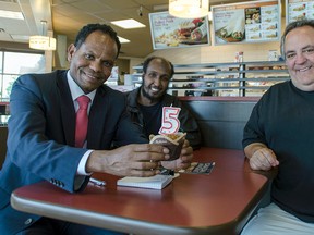 Gezahgn Wordofa, left, founder of the Multicultural Association Perth-Huron, with volunteers Jama Botun and Chris Fournier celebrate the non-profit organization’s fifth anniversary of helping new immigrants and refugees relocate to Huron-Perth. Wordofa organized the party at a local Goderich Tim Hortons in recognition that most of the work he does with newcomers to Canada is conducted in cafes throughout the county. (Darryl Coote/The Goderich Signal Star)