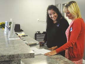 The Arrowwood ATB agency opened on Oct. 4 in the Arrowwood Mall. Here, Arrowwood ATB agent Virginia Toly and Debbie Seath, customer relationship specialist, look over some paperwork on Oct. 5.