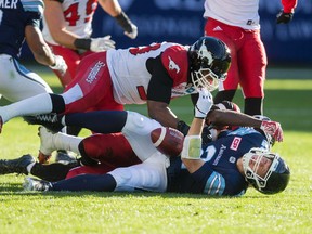 Argonauts quarterback Drew Willy is tackled by a Stampeder on Monday. (Ernest Doroszuk/Toronto Sun)