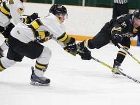 Tye Lindeman of the Powassan Voodoos battles for the puck with  Jack Speer of the Iroquois Falls Eskies during NOJHL Showcase action from the Gerry McCrory Countryside Sports Complex in Sudbury, Ont. on Tuesday October 11, 2016. The event continues today and runs all day and wraps up with the Rayside-Balfour Canadians against the Blind River Beavers at 9pm.Gino Donato/Sudbury Star/Postmedia Network