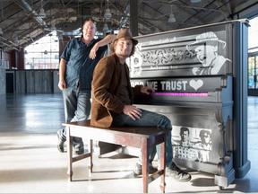 Pianist Tyler Kealey and singer Glen Badour perform a duet while helping to unveil the "Pianos in the Parks" piano with a mural of Tragically Hip frontman Gord Downie. This is the first of their pianos that is dedicated to a Canadian performing artist.  (Wayne Cuddington/ Postmedia)