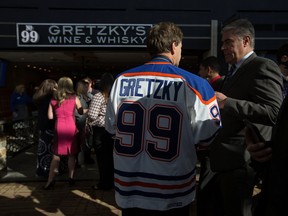 Guests mingle during the opening of No. 99 Gretzky's Wine & Whisky, at the Edmonton International Airport in Edmonton October 11, 2016. Amber Bracken / Postmedia