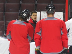 Senators coach Guy Boucher gives instructions to the team at practice on Oct. 12. (Jean Levac, Postmedia Network)