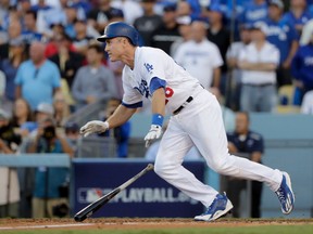 Dodgers' Chase Utley watches his RBI single during the eighth inning in Game 4 of the NL Division Series against the Nationals in Los Angeles on Tuesday, Oct. 11, 2016. (Jae C. Hong/AP Photo)