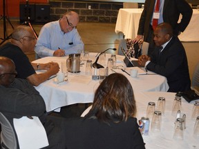 Jim Moodie/Sudbury Star
Pascal Joseph of Sudbury, top left, makes a point to Justice Michael Tulloch, right, of the Independent Police Oversight Review at Cambrian College.