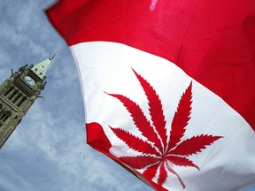 A Canadian flag with a marijuana leaf flies alongside Parliament Hill in Ottawa, in this June 5, 2004 file photo. (Donald Weber/Getty Images)