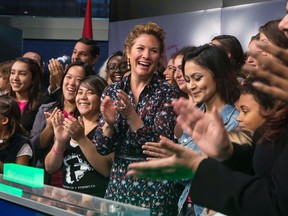 Sophie Gregoire Trudeau, centre, stands with girls representing G(girls)20 FitSpirit/Fillactive and Plan International Canada after opening the market at the TSX in Toronto to celebrate International Day of the Girl, on Tuesday October 11, 2016. THE CANADIAN PRESS/Chris Young